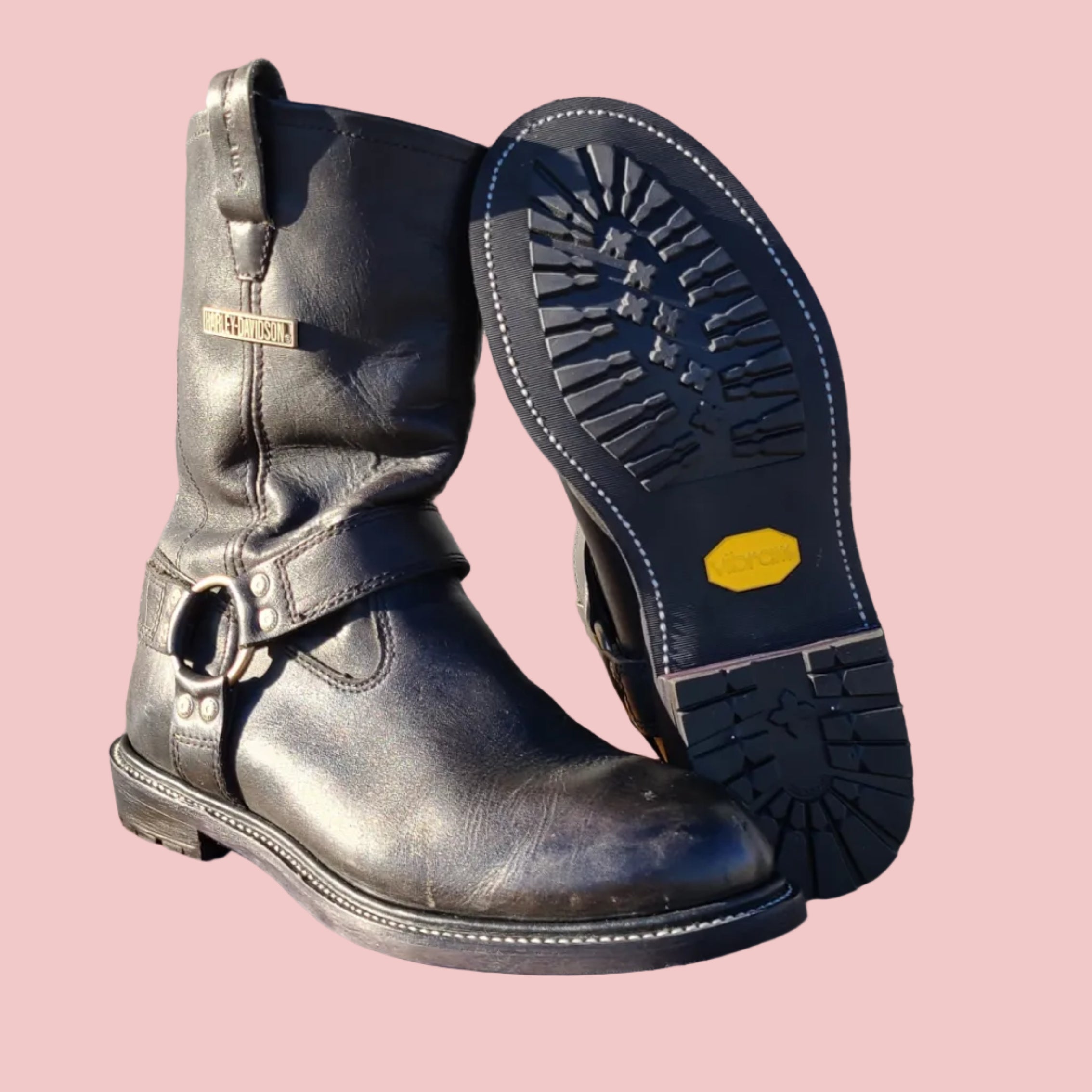 Black harness boot resoled with Vibram and storm welt 