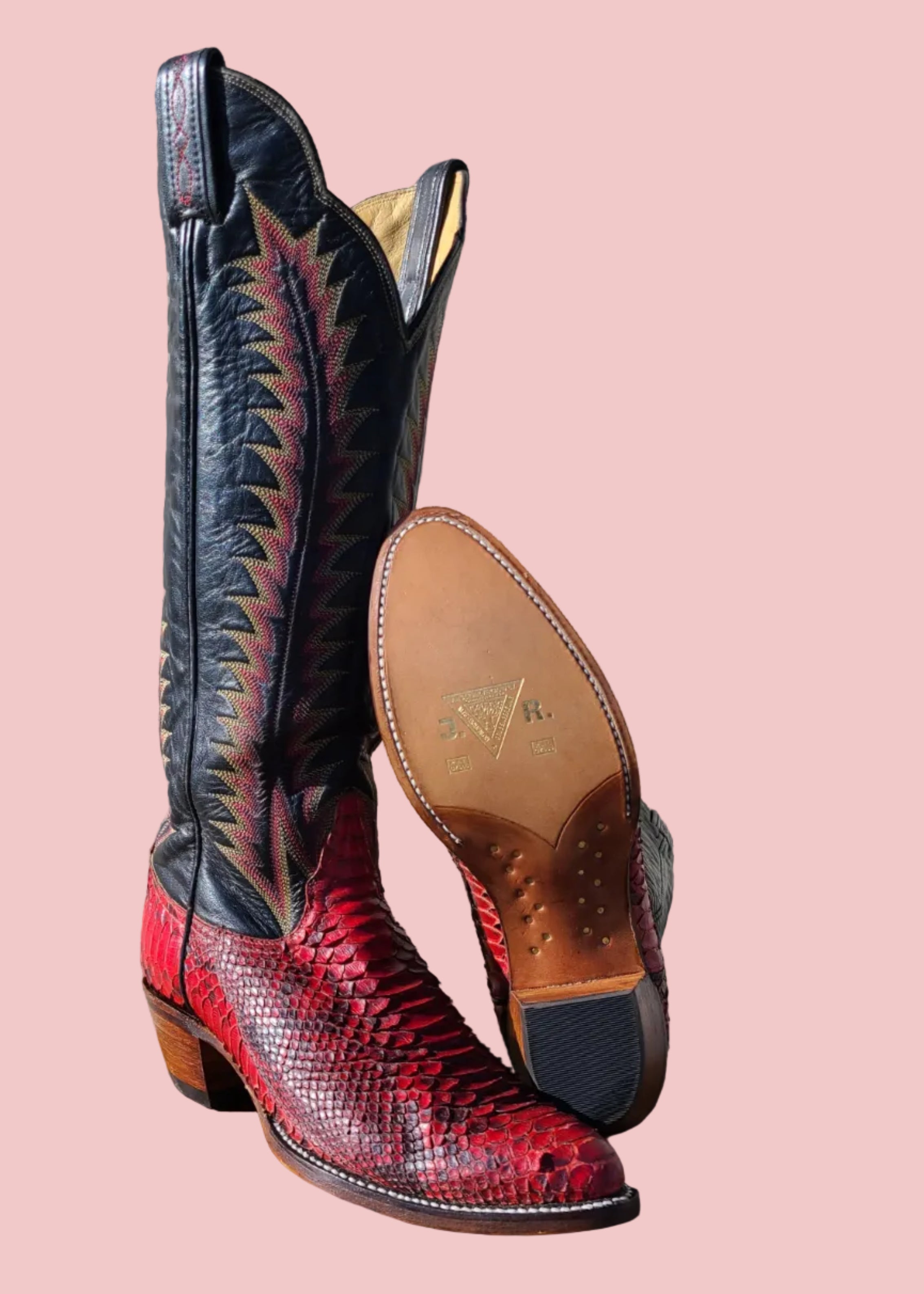 Tall red and black snakeskin cowboy boot resoled with JR leather